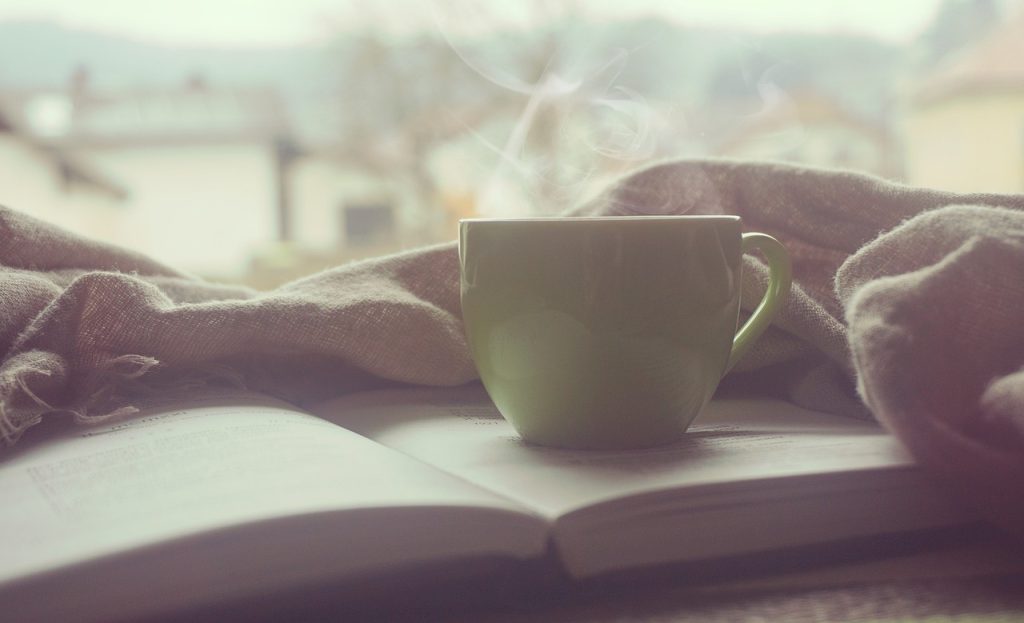 A cup of coffee on a surface, suggesting a relaxed morning breakfast moment.